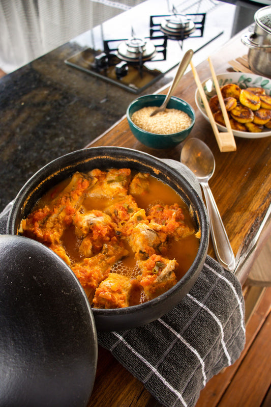 A rustic pot of Basque-style bonito and potato stew (marmitako) in a rich red broth